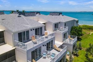 an aerial view of a house with the ocean at Lighthouse Resort & Club in Sanibel