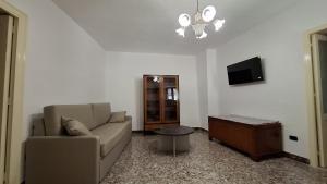 a living room with a couch and a tv at Casa vacanze Donna Santa in San Marco dʼAlunzio