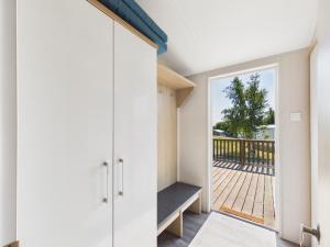 a room with a door leading to a balcony at Pinehurst, 65 Golf View Lodge in Jedburgh
