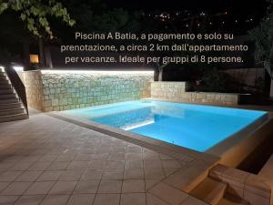 a swimming pool in a backyard at night at Casa vacanze Donna Santa in San Marco dʼAlunzio