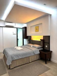 a bedroom with a large bed in a room at PCB The Seven Gardens Resort & Spa in Kota Bharu