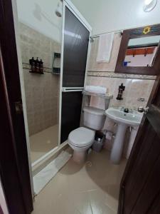 a bathroom with a toilet and a shower and a sink at Hotel Cristo Rey Campestre in Los Santos +120 photos