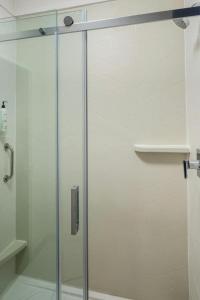 a shower with a glass door in a bathroom at Fairfield by Marriott Middletown Monroe in Middletown