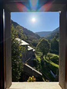 a view from a window of a house with a view at La Caze in Saint-Pierre-des-Tripiers +26 photos