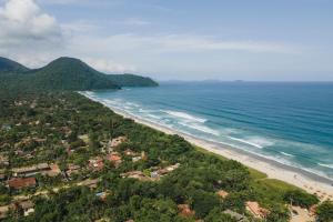 an aerial view of a beach and the ocean at Casa Viva Itamambuca in Ubatuba