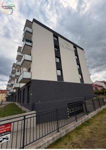 a building with a sign on the side of it at Apartament Olimpia in Lębork