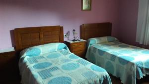 Кровать или кровати в номере Apartamentos Alejandra