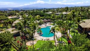 an aerial view of a resort with a pool and palm trees at Mauna Lani Fairways 302 in Waikoloa