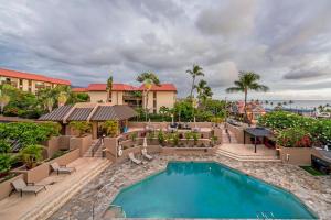 an image of a swimming pool at a resort at Kona Pacific A306 in Kailua-Kona