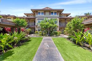 a large house with a lawn in front of it at Halii Kai 20F in Waikoloa