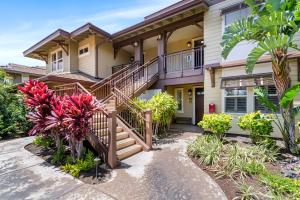 a house with stairs and plants in front of it at Halii Kai 20F in Waikoloa