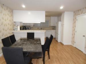 a kitchen with a dining room table and chairs at STR25-15 Home 3 Bedrooms 2 Bath in Marina
