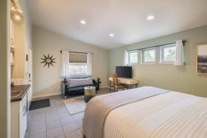 a bedroom with a bed and a chair and a desk at The Entrada Flat 1 in Moab UT in Moab