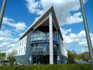 an office building with a large window at Holiday Inn London Luton North in Luton
