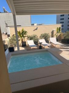 a swimming pool on the roof of a building at Cedrino suite apartment in Cagliari