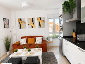 a living room with a couch and a table at Dunas de Corrubedo in Ribeira