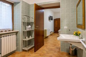 a bathroom with a sink and a mirror at Villa Paradiso in Pioraco +38 photos