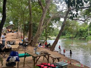 a group of people playing in the water at a park at เป้แคมป์ปิ้งเขาใหญ่ in Ban Khanong Phra Tai +14 photos