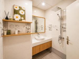 a bathroom with a sink and a shower at Sea View Apartment Muong Thanh Oceanus Nha Trang in Nha Trang