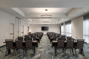 a conference room with tables and chairs and a screen at SpringHill Suites by Marriott Abilene in Abilene +27 photos