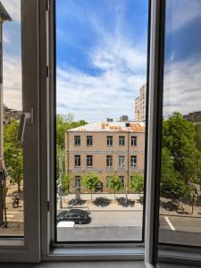 an open window with a view of a building at Green Hostel in Yerevan