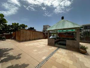 a pavilion with a roof on a patio at Villa malaka in Dakar