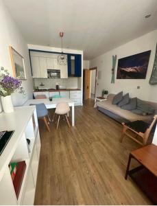 a living room with a couch and a table at CasaGerman in Sierra Nevada