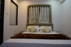 Postel nebo postele na pokoji v ubytování Hotel Pearl