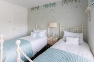 two beds sitting next to each other in a bedroom at Grangebeg B&B Dunlavin W91FK50 in Dún Luáin