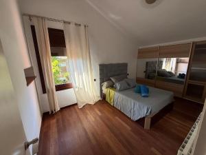 a bedroom with a bed and a large window at Casa Natura Flassia de 240m2 con piscina privada in Vidreres +80 photos
