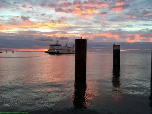 a boat in the water with two poles in the water at Emes Stuuv in Oevenum +24 photos