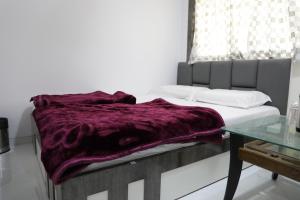 Postel nebo postele na pokoji v ubytování Hotel Pearl