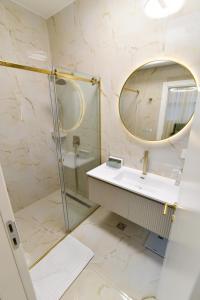 a bathroom with a sink and a mirror at Dream Palace 2 in Belgrade