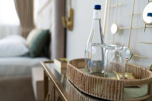 a basket with a bottle and glasses on a table at Dream Palace 2 in Belgrade