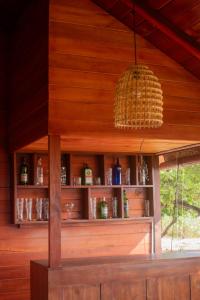 a room with a wooden wall with a shelf at Villa Downsouth Nilaveli in Kumpurupiddi