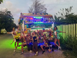 a group of people posing in front of an ice cream truck at CO Casa Ocean in Juan de Acosta