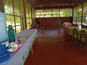 a room with tables and chairs in a building at Amazon Lodge and Expeditions in Iquitos +50 photos