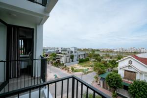 an apartment balcony with a view of a street at Thành Danh Hotel in Dong Hoi