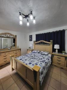 a bedroom with a bed and a blue curtain at Coco Sol 3 by MyMiamiStay in Miami