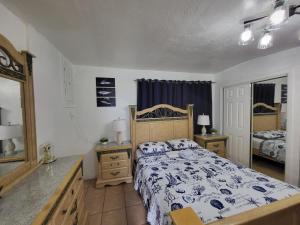 a bedroom with a bed and a dresser and a mirror at Coco Sol 3 by MyMiamiStay in Miami