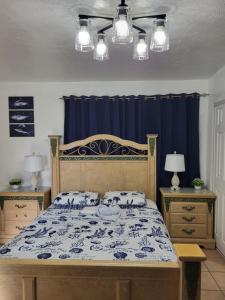 a bedroom with a bed with a blue curtain at Coco Sol 3 by MyMiamiStay in Miami