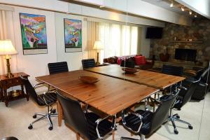 a room with a large wooden table and chairs at Chateau Dumont Unit 10, Centrally Located Condo, 1 Block from the Gondola in Aspen