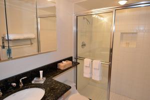 a bathroom with a sink and a shower at Chateau Dumont Unit 10, Centrally Located Condo, 1 Block from the Gondola in Aspen +2 photos