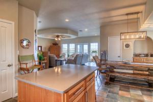 a kitchen and living room with a table and chairs at Happy Heron in Port Aransas +18 photos