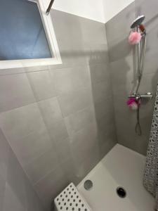a bathroom with a shower and a sink at Superbe appart chic & élegant 2ch - 6 pers in Deuil-la-Barre +21 photos