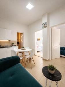 a living room with a couch and a table at Montebello Inn apartments in Ulcinj