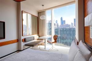 a hotel room with a bed and a large window at The Standard, High Line New York in New York +72 photos