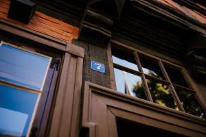 a door to a building with a sign on it at Boutique Apartment QLB est 1688 in Quedlinburg