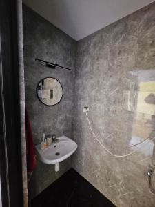 a bathroom with a sink and a mirror at Dom w Zbychowie in Gniewowo +13 photos