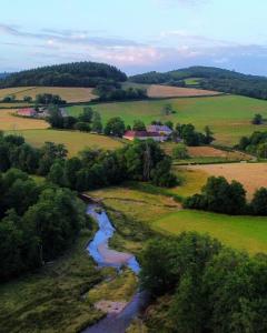 an aerial view of a river in a field at Chateau de Salorges - Field gite I in Corancy